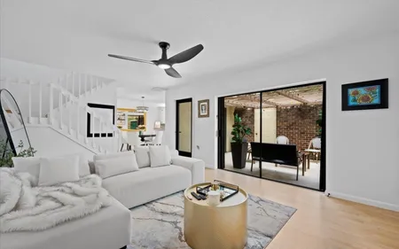 White, open living room in a Palm Beach Gardens condo